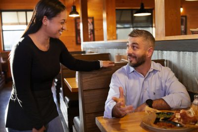 Sonny's server shares a laugh with guest