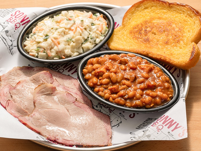 Sliced pork Pitmaster Lunch Plate with two sides at Sonny's BBQ