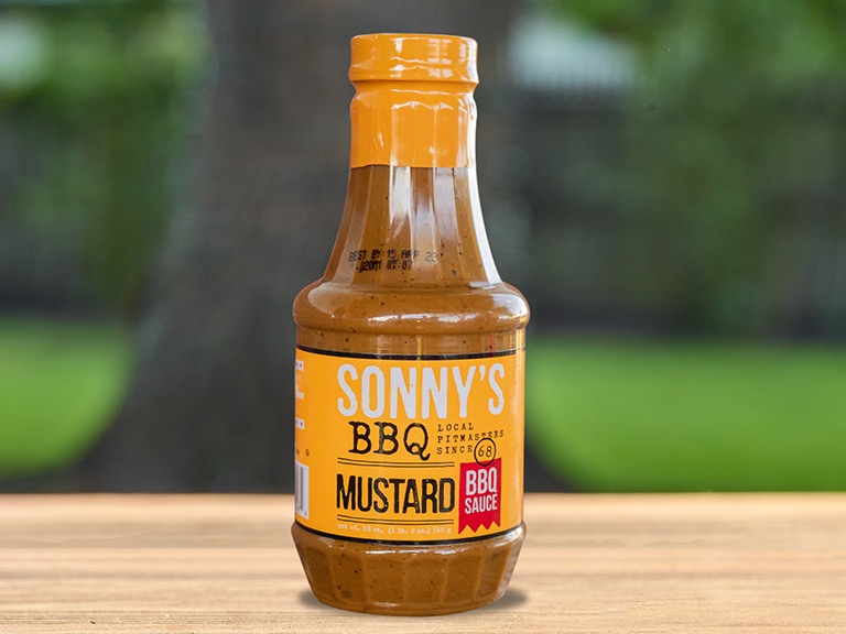 A bottle of Sonny's BBQ Mustard BBQ sauce.