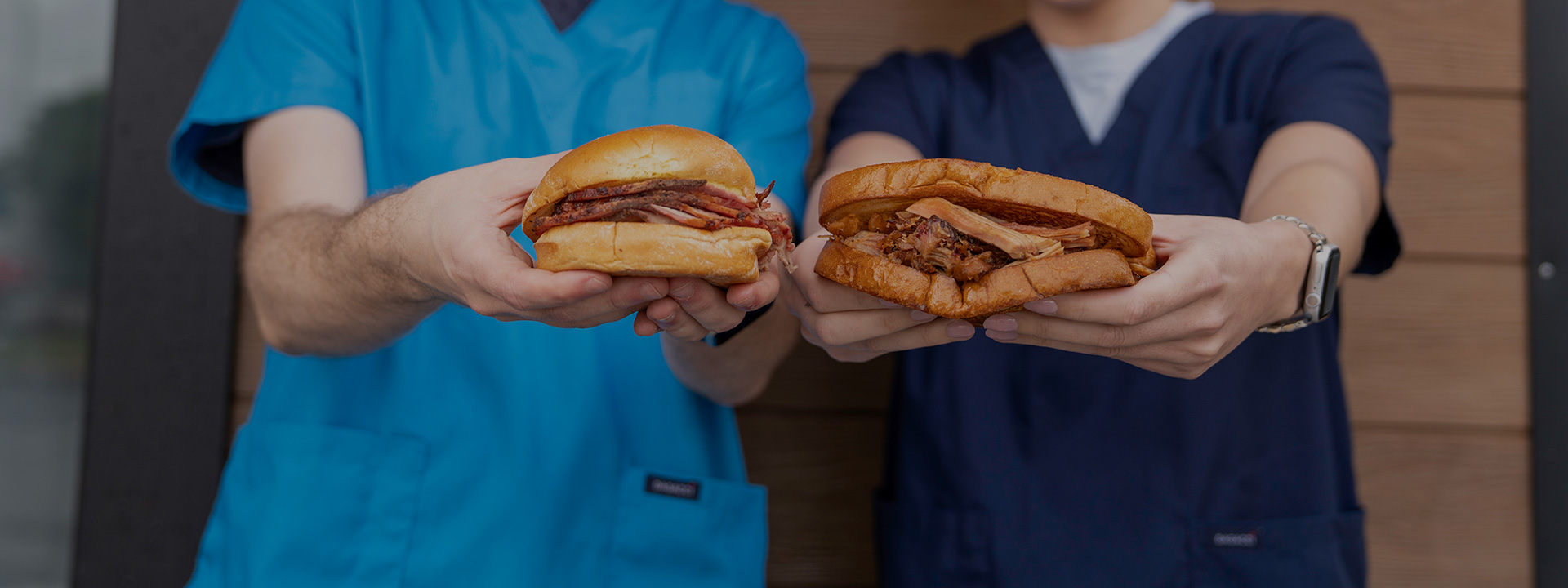 Nurses hold BBQ pork sandwiches