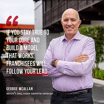 A man stands outside an office building with his arms crossed, to his left is a quote that reads 