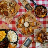 Spread of National Pulled Pork Day items sits on table.