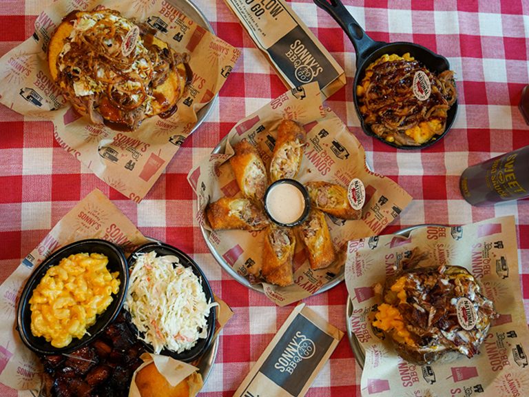 Spread of National Pulled Pork Day items sits on table.