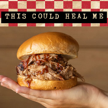 Person holds pulled pork sandwich in front of camera, text reads 