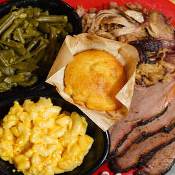 Pick 2 plate of Sonny's BBQ with brisket, pulled pork, green beans, mac and cheese and cornbread