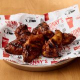 Sauced and tossed Smoked Chicken Wings from Sonny's BBQ.