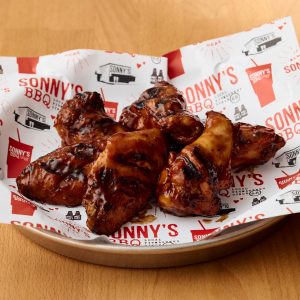 Sauced and tossed Smoked Chicken Wings from Sonny's BBQ.