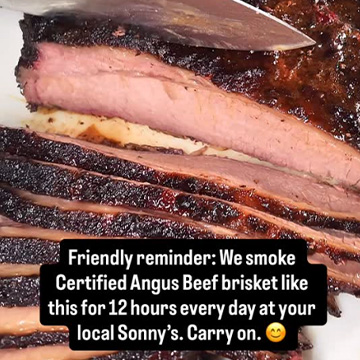 Sliced Brisket sits on cutting board