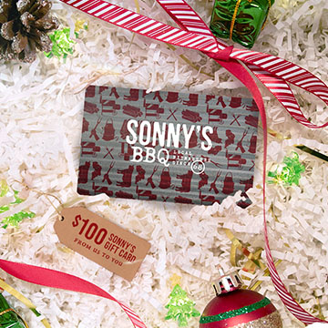 Gift Card laying amongst Christmas decor