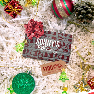 Gift Card laying amongst Christmas Presents