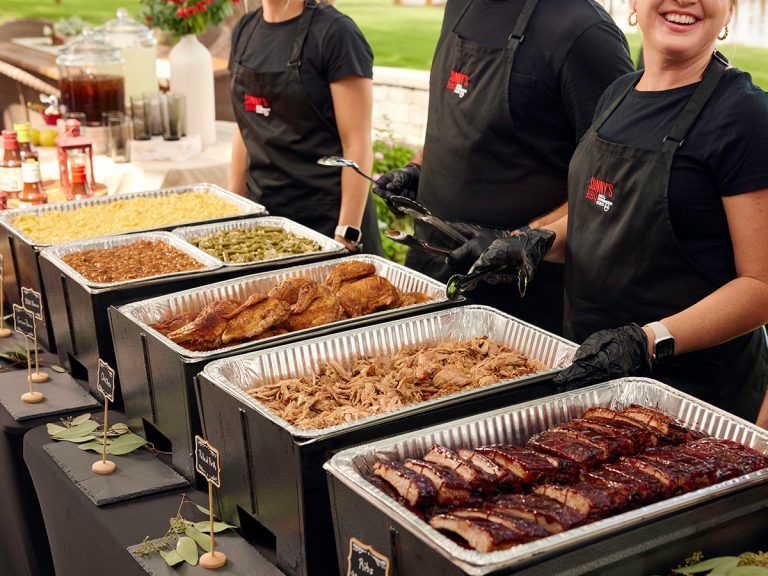 Catering Spread featuring Ribs, pork, chicken, green beans, BBQ beans and Mac.