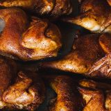 Cooked Half Chickens on Baking Sheet.