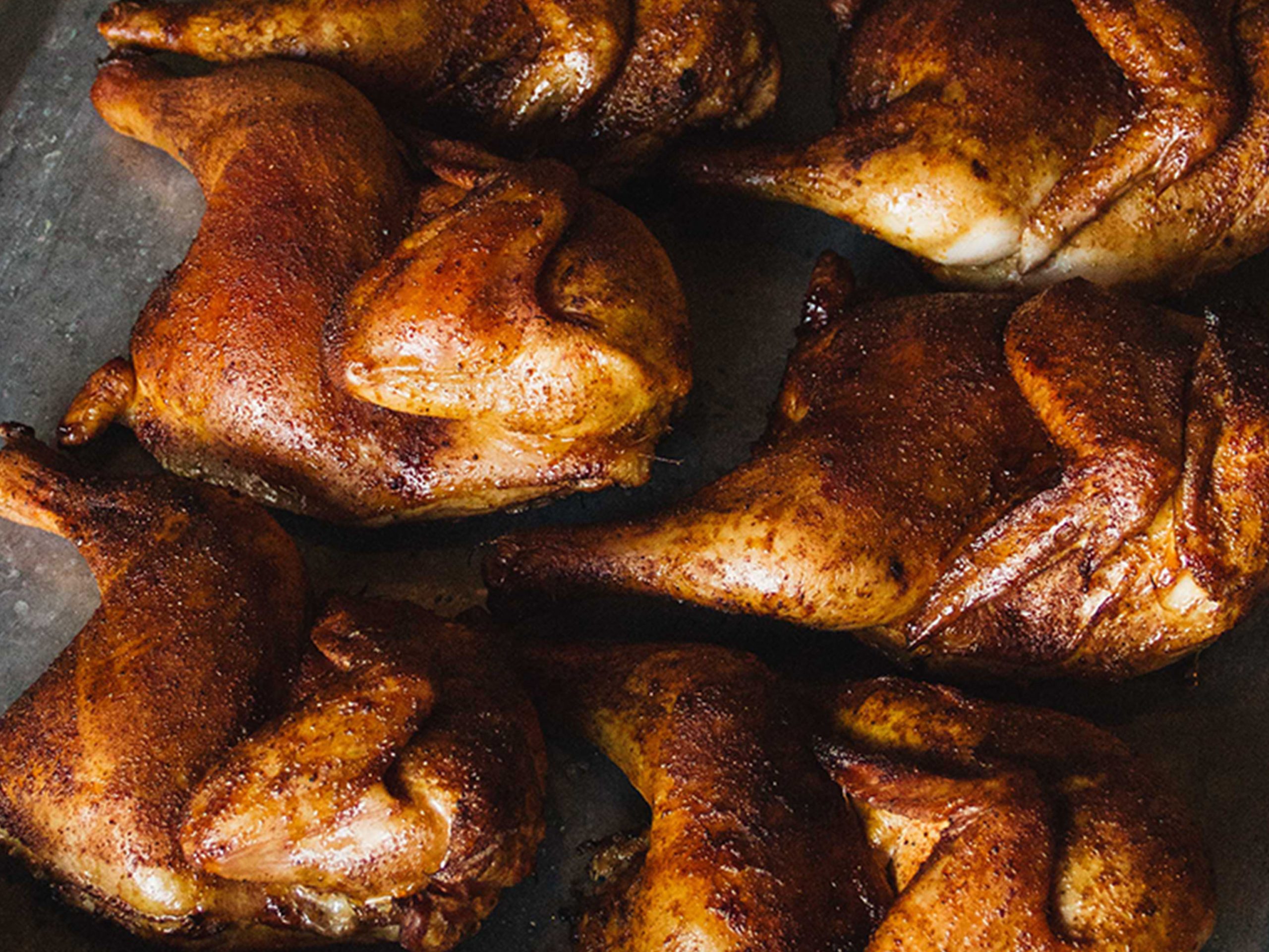 Cooked Half Chickens on Baking Sheet.