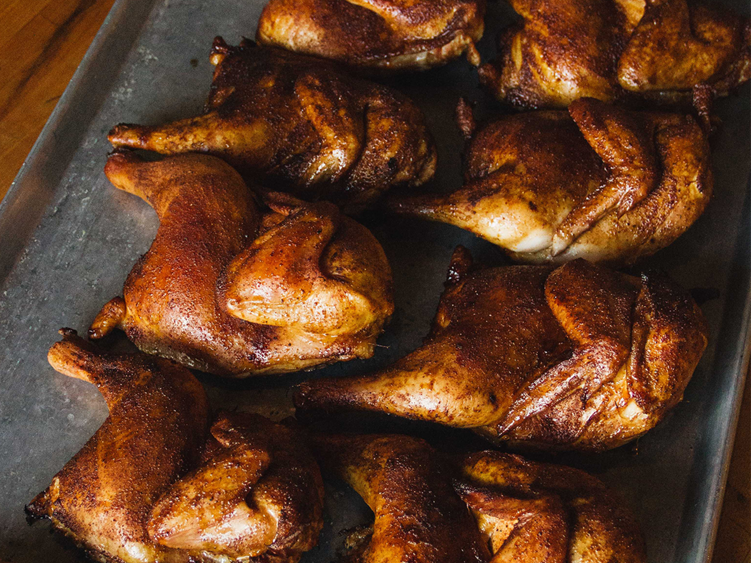 Cooked Half Chickens on Baking Sheet.