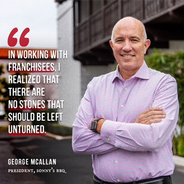 Man stands in front of building with quote highlighted
