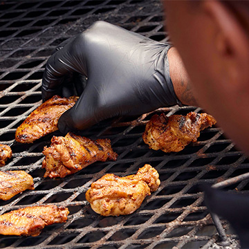 Pitmaster Grabs Wings on Grill