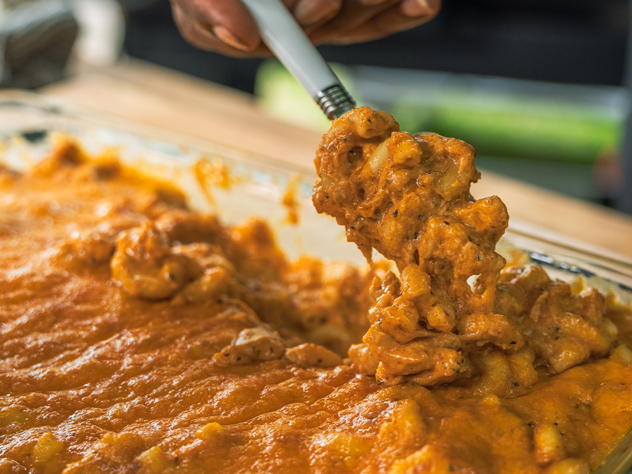 Fork dives into pan full of smoked mac & cheese