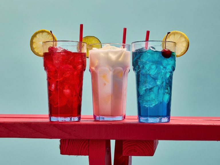 Three Seasonal Sips hero shot — Coconut Cabana Fizz, Cherry Pop Lemonade, and Blue Razz Blast together