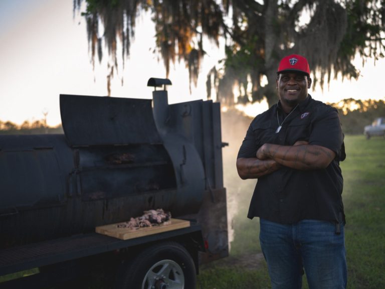 Pitmaster Shannon portrait at the smoker