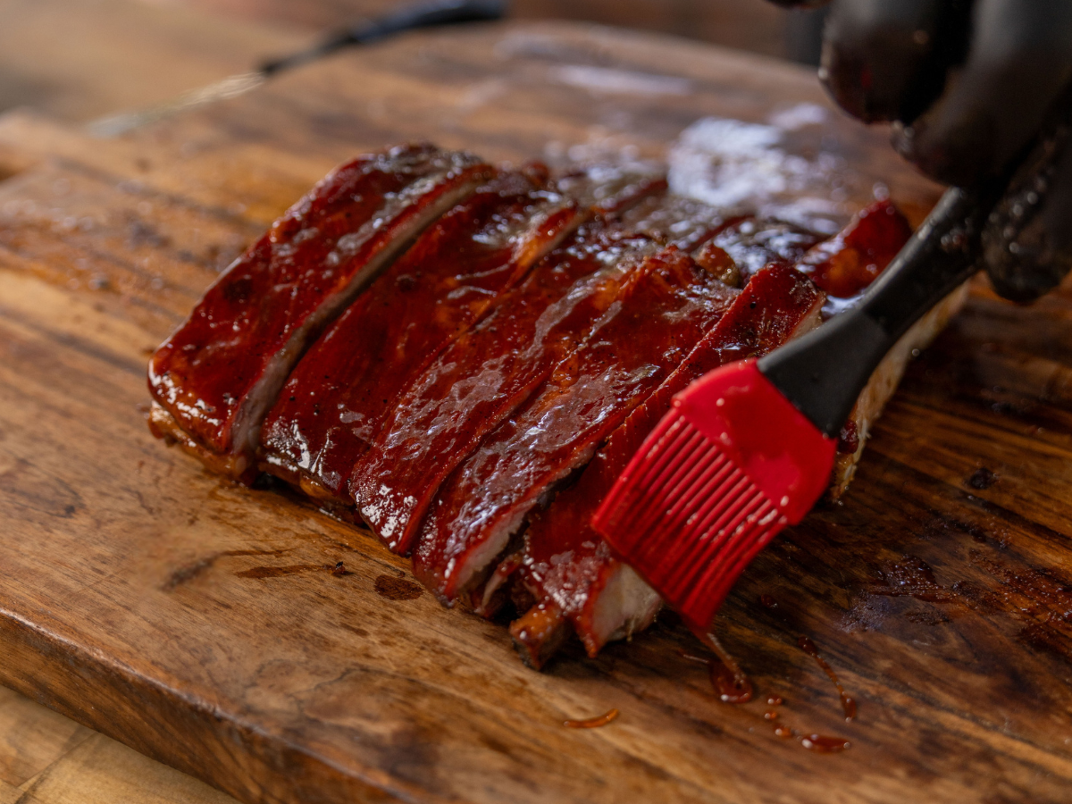 Brush slaters sauce on Smoked Baby Back Ribs