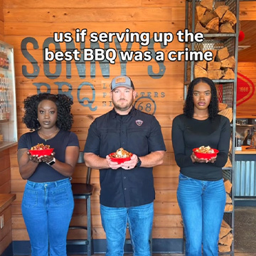 Three team members hold BBQ Bowls and face camera.