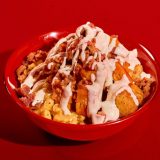 Sonny's Kickin' Chicken Bowl on Red Table.