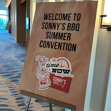 Sign in hotel hallway reads 
