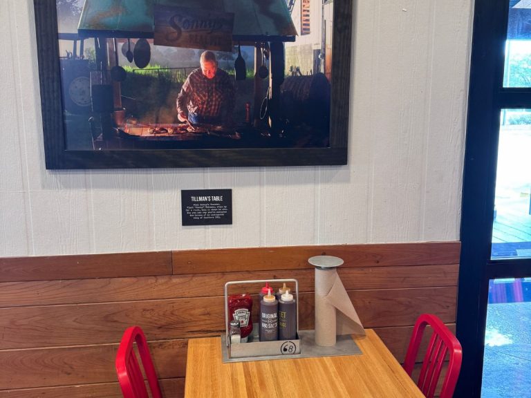 Table inside Sonny's restaurant, a placard above it reads "Tillman's Table"