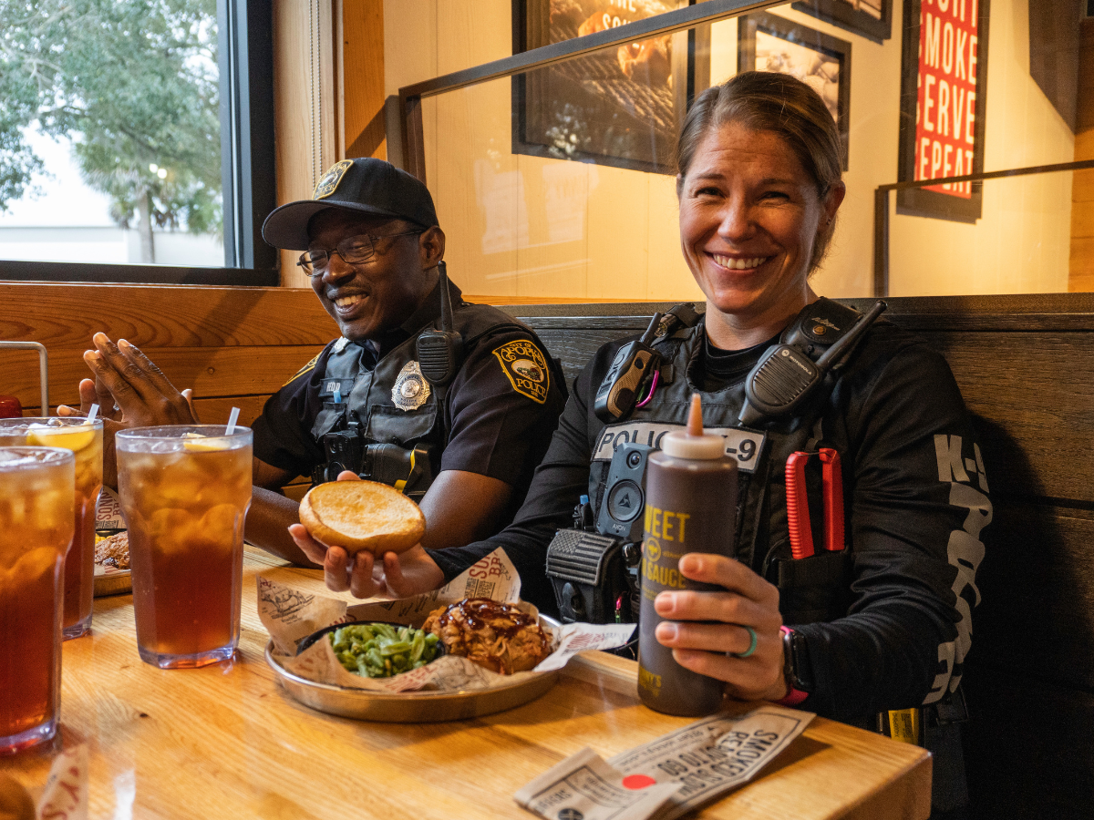 Police Officers sit at table enjoying First Responders Offer